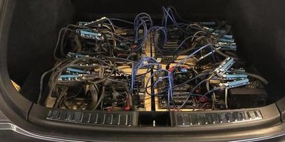 Upgraded ASIC miner on a metal rack showcasing performance improvements